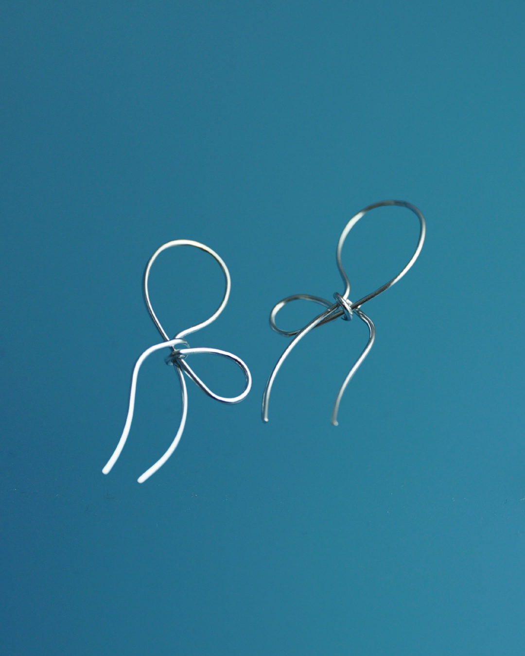 Minimalist Silver Wire Bow Earrings - Sculptural Studs